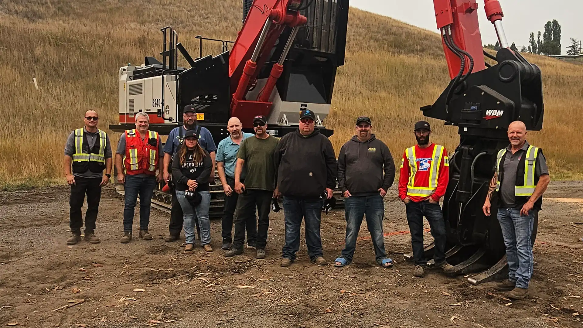 Finalists and winners of the Link-Belt Log Loader Competition posing for a photo at the Williams Lake Harvest Fair