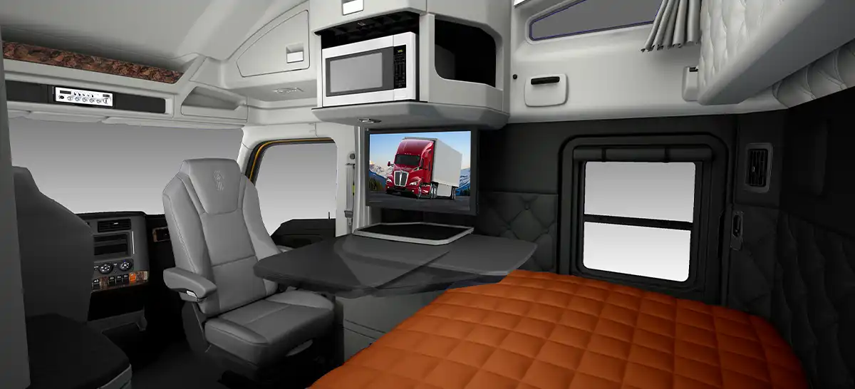 Kenworth T680 Driver's Studio sleeper interior with swivel seat and TV mount
